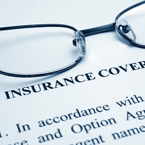 Glasses over a dental insurance claim form