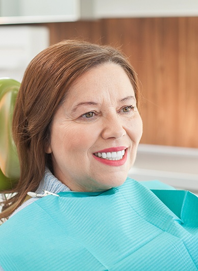 Woman smiling in the dental chair