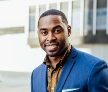 Smiling man in dark blue suit jacket