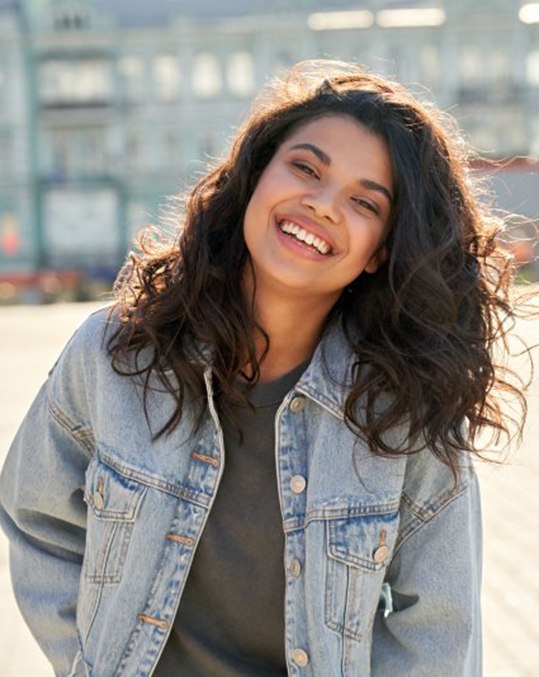 Lady smiles in parking lot