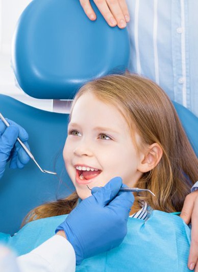 Child smiles at dentist