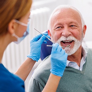 Man smiles at dental hygienist