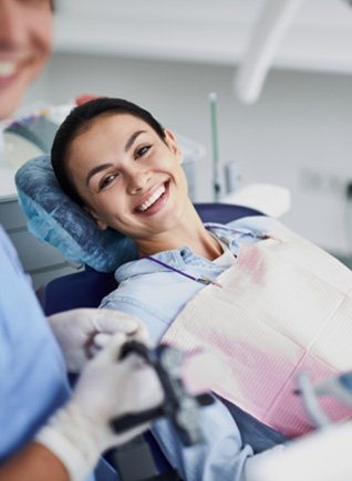Woman smiling while at the dentist